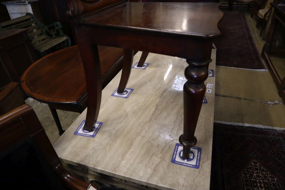 A pair of Victorian carved mahogany hall chairs